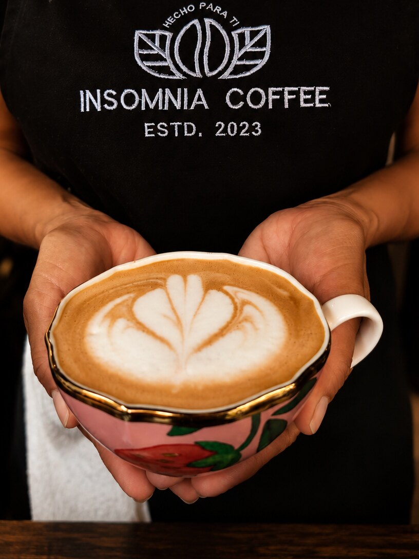 Barista pouring latte art